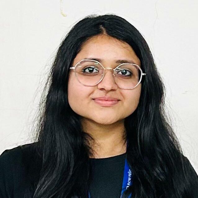 Welcome to our new Council members 1 Photo of an indian woman with long dark hair worn loose, she is wearing glasses and dark clothes with a blue lanyard.